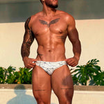 model wearing Caio Slim Nova Frost (white) swim brief - Brazilian Sunga. 